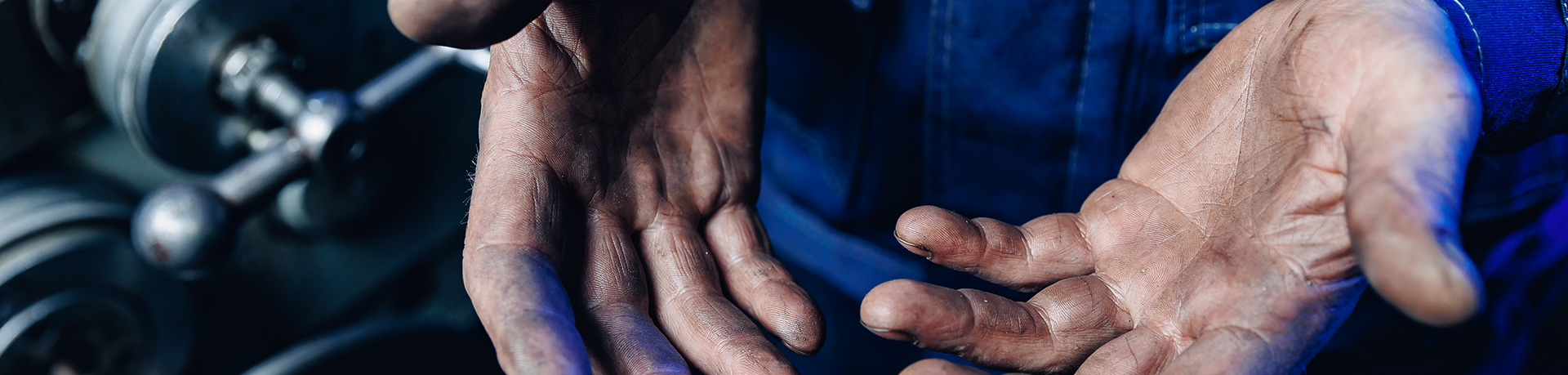 Man cleaning oily hands